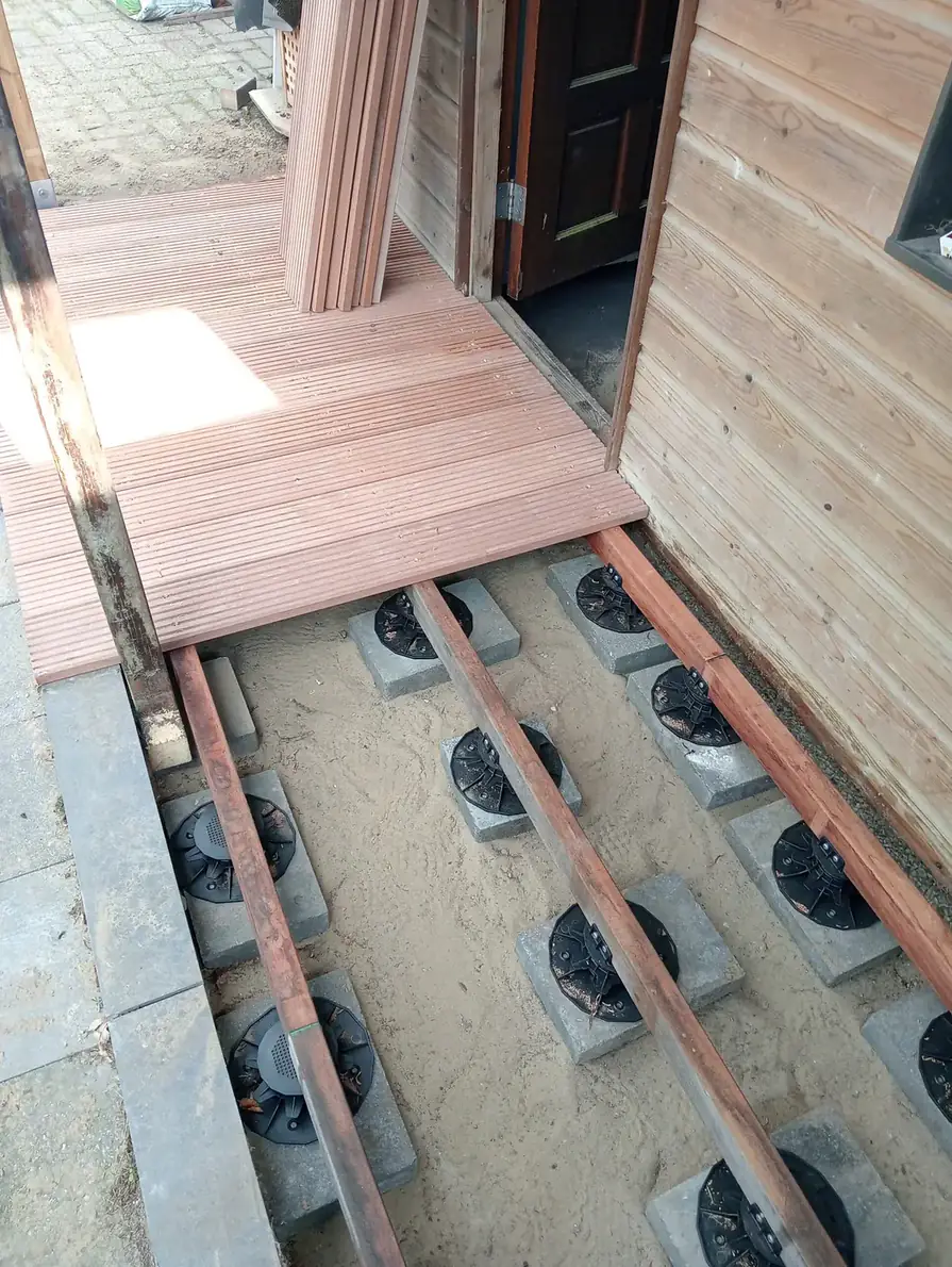 Hardwood decking around a log cabin, photo 2